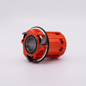 Orange replacement freehub body for Edition One road hub, front view