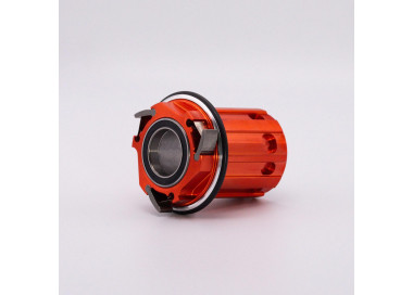 Orange replacement freehub body for Edition One road hub, front view