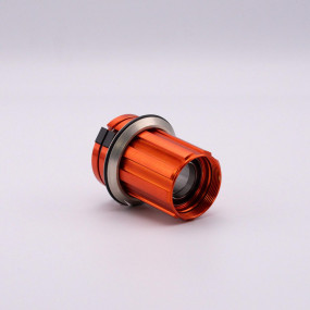 Orange freehub body with pawls, springs and bearings