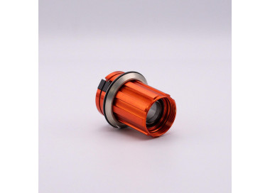 Orange freehub body with pawls, springs and bearings